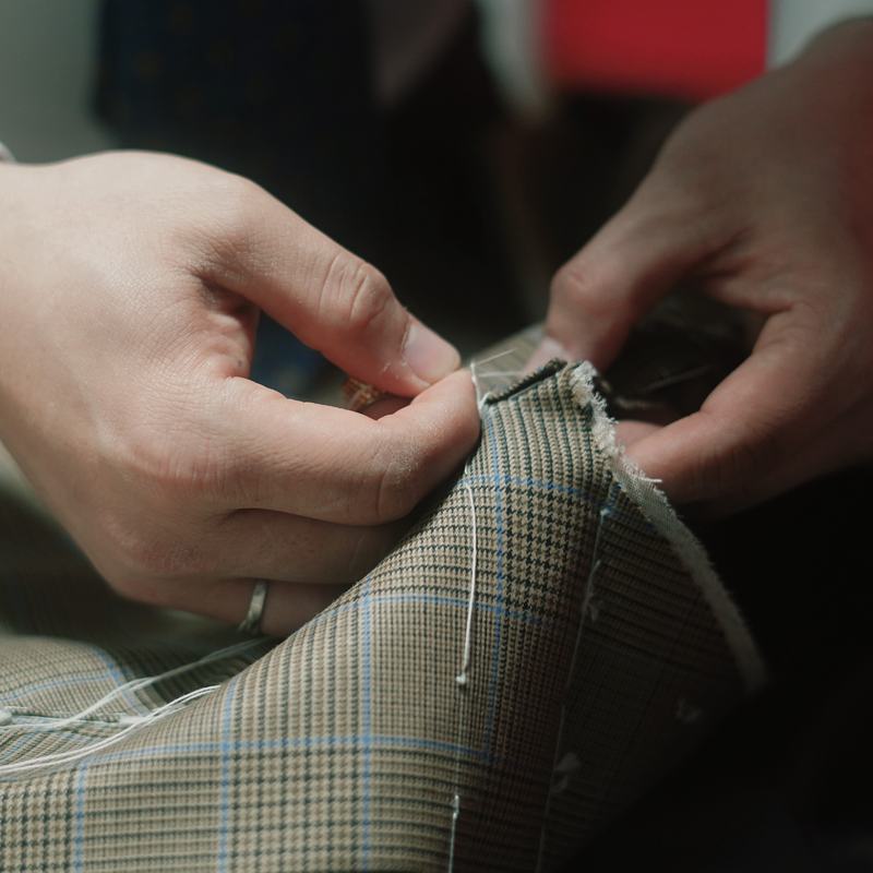 Hand stitching a checked cloth